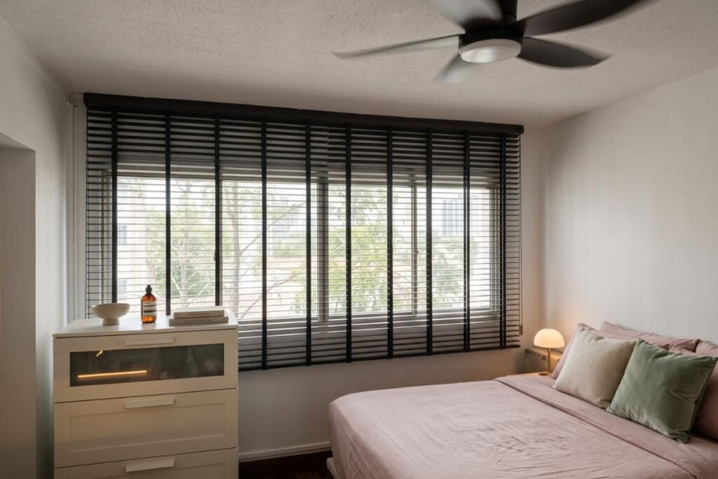 Faux wood Venetian blinds for a Pasir Ris HDB bedroom in Singapore by Cornerstone