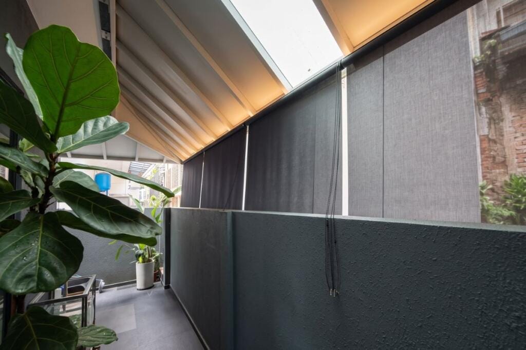 Outdoor roller blinds for a sheltered landed patio in Bukit Timah, Singapore by Cornerstone