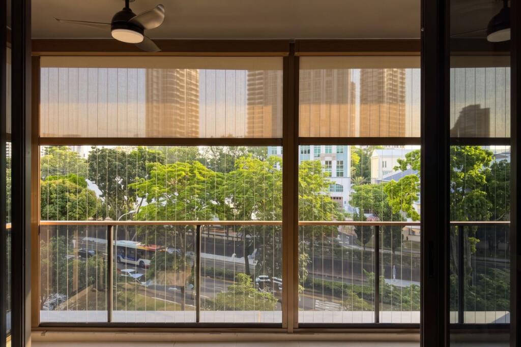 ZipScreen outdoor blinds shading a Newton condo balcony in Singapore by Cornerstone